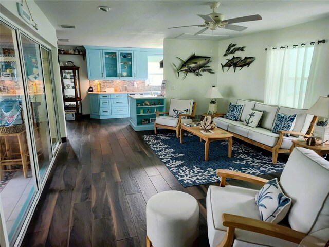 1626 Sea Breeze Dr, Tarpon Springs, FL 34689 - living area with dark wood-style flooring and a ceiling fan