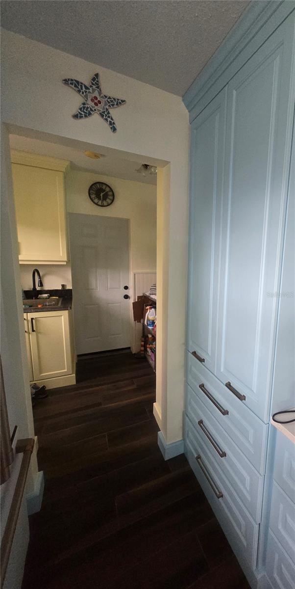 1626 Sea Breeze Dr, Tarpon Springs, FL 34689 - hallway featuring dark wood finished floors