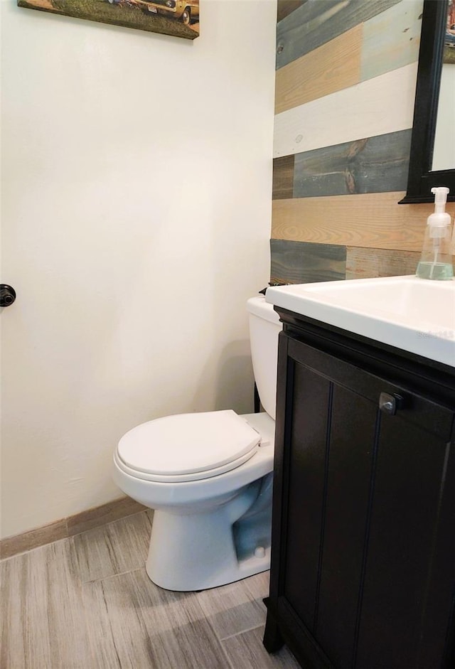 1626 Sea Breeze Dr, Tarpon Springs, FL 34689 - half bathroom featuring vanity and wood finished floors