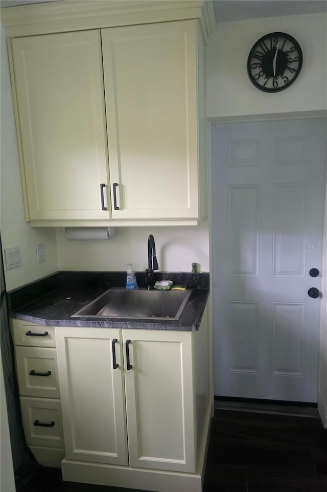 1626 Sea Breeze Dr, Tarpon Springs, FL 34689 - kitchen featuring white cabinetry and dark wood-style floors