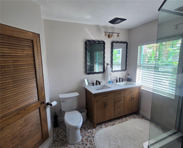 1626 Sea Breeze Dr, Tarpon Springs, FL 34689 - full bath with double vanity and a textured ceiling