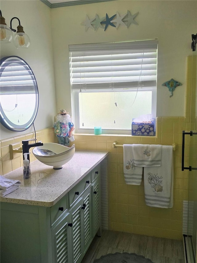 1626 Sea Breeze Dr, Tarpon Springs, FL 34689 - bathroom with vanity, tile walls, and a stall shower