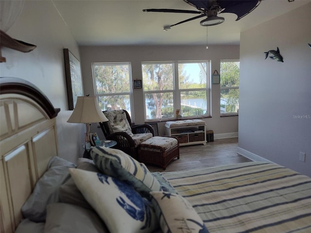1626 Sea Breeze Dr, Tarpon Springs, FL 34689 - living room with plenty of natural light, a ceiling fan, and wood finished floors