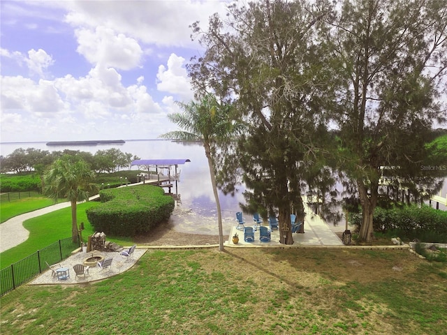 1626 Sea Breeze Dr, Tarpon Springs, FL 34689 - dock with a fire pit, a water view, and a patio area