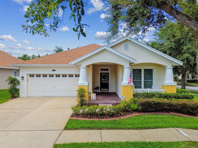 18203 Tivoli Ln, Lutz, FL 33558 - view of front facade with a garage, stucco siding, covered porch, and concrete driveway