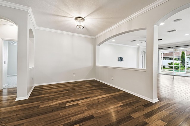 18203 Tivoli Ln, Lutz, FL 33558 - unfurnished dining area with ceiling fan, dark wood finished floors, crown molding, and arched walkways
