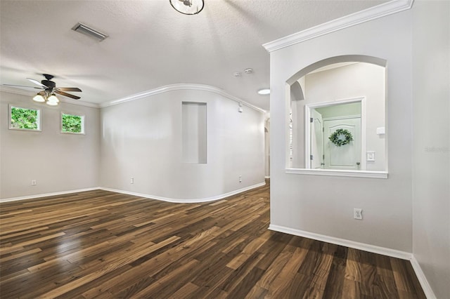 18203 Tivoli Ln, Lutz, FL 33558 - empty room featuring ceiling fan, arched walkways, wood finished floors, ornamental molding, and a textured ceiling