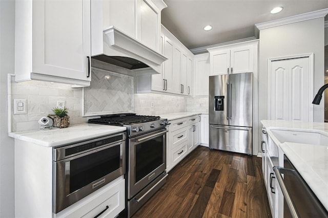 18203 Tivoli Ln, Lutz, FL 33558 - kitchen featuring premium appliances, white cabinets, light stone counters, premium range hood, and dark wood-style flooring