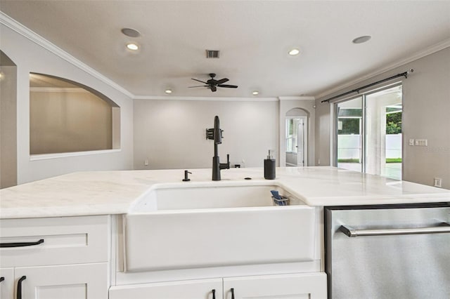 18203 Tivoli Ln, Lutz, FL 33558 - kitchen featuring stainless steel dishwasher, crown molding, recessed lighting, white cabinets, and a ceiling fan