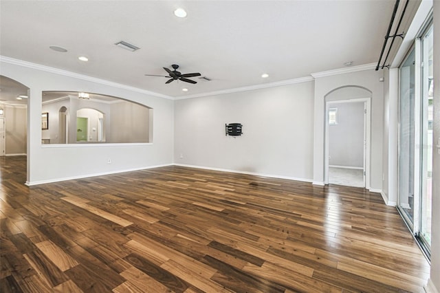 18203 Tivoli Ln, Lutz, FL 33558 - unfurnished living room with a ceiling fan, dark wood-style flooring, arched walkways, recessed lighting, and ornamental molding
