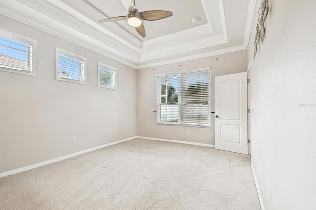 18203 Tivoli Ln, Lutz, FL 33558 - unfurnished room featuring ornamental molding, light carpet, a raised ceiling, ceiling fan, and a smoke detector