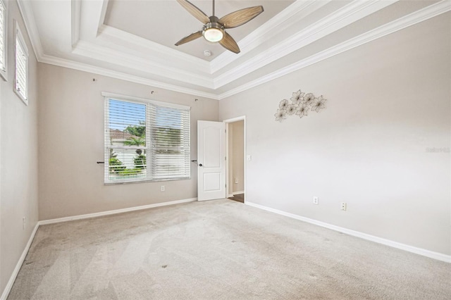 18203 Tivoli Ln, Lutz, FL 33558 - unfurnished room with plenty of natural light, light carpet, crown molding, ceiling fan, and a tray ceiling