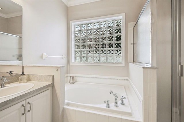 18203 Tivoli Ln, Lutz, FL 33558 - full bathroom featuring crown molding, vanity, a garden tub, and a stall shower