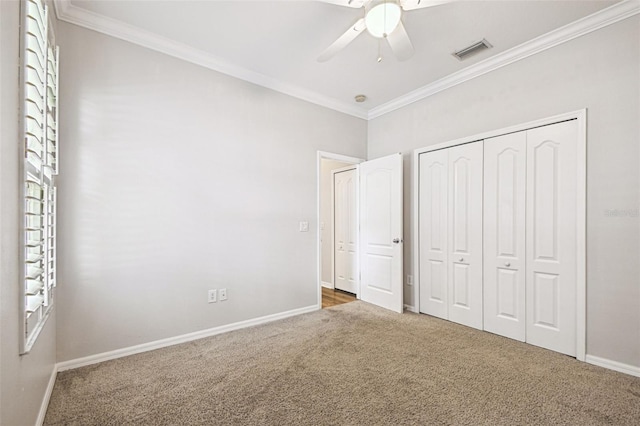 18203 Tivoli Ln, Lutz, FL 33558 - unfurnished bedroom featuring carpet, crown molding, a closet, and ceiling fan