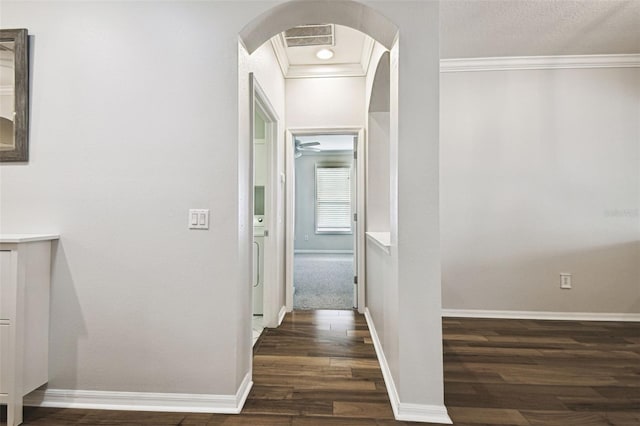 18203 Tivoli Ln, Lutz, FL 33558 - hallway featuring arched walkways, dark wood-style flooring, and ornamental molding