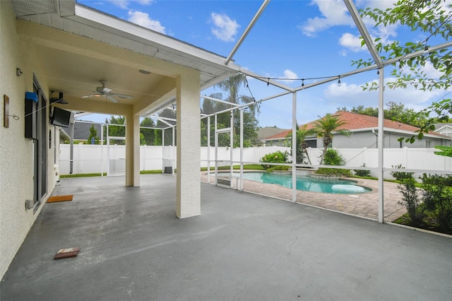 18203 Tivoli Ln, Lutz, FL 33558 - view of swimming pool featuring a ceiling fan, a patio area, a fenced backyard, and a lanai