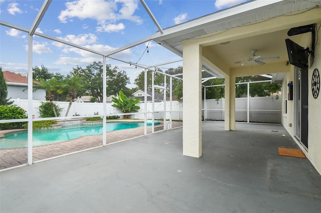 18203 Tivoli Ln, Lutz, FL 33558 - view of swimming pool featuring a patio, a fenced backyard, a ceiling fan, and a lanai