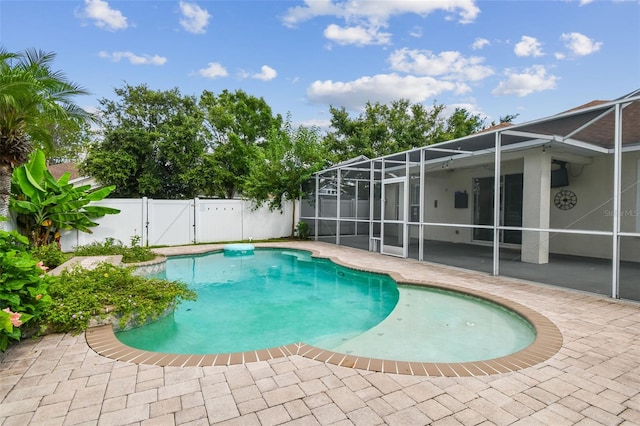 18203 Tivoli Ln, Lutz, FL 33558 - view of pool with a patio, a fenced backyard, a gate, and a lanai