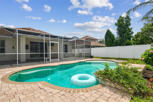 18203 Tivoli Ln, Lutz, FL 33558 - view of swimming pool featuring a fenced backyard, a patio, and glass enclosure