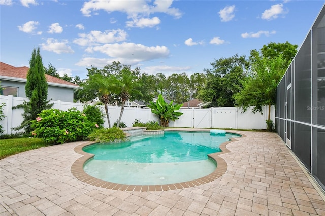 18203 Tivoli Ln, Lutz, FL 33558 - view of pool featuring a fenced backyard, a patio, glass enclosure, and a gate