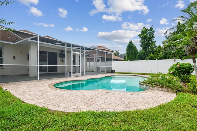 18203 Tivoli Ln, Lutz, FL 33558 - view of pool with a patio area, a lanai, and a fenced backyard