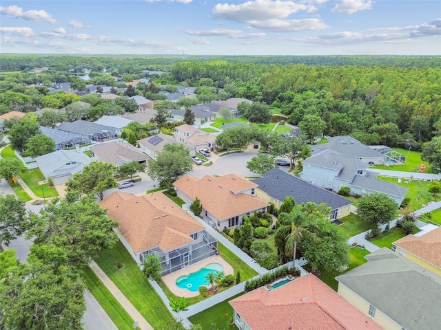 18203 Tivoli Ln, Lutz, FL 33558 - aerial view of residential area featuring a pool and a heavily wooded area
