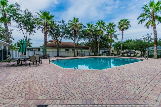 18203 Tivoli Ln, Lutz, FL 33558 - community pool with a patio