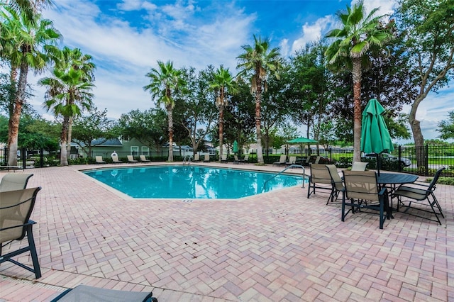 18203 Tivoli Ln, Lutz, FL 33558 - community pool featuring a patio area