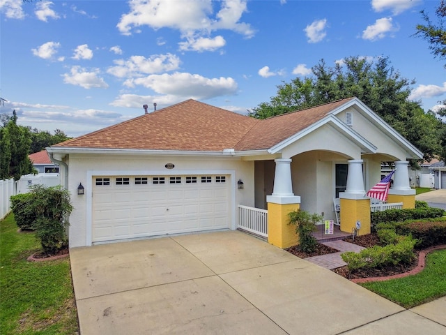 18203 Tivoli Ln, Lutz, FL 33558 - view of front of house with stucco siding, covered porch, a garage, concrete driveway, and a shingled roof