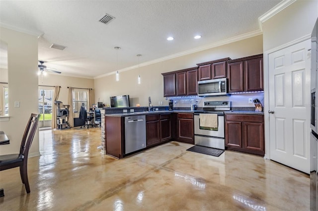 1031 Andrew Aviles Cir, Tampa, FL 33619 - kitchen featuring stainless steel appliances, a peninsula, crown molding, dark countertops, and ceiling fan