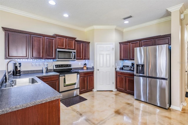 1031 Andrew Aviles Cir, Tampa, FL 33619 - kitchen featuring appliances with stainless steel finishes, crown molding, a textured ceiling, and recessed lighting
