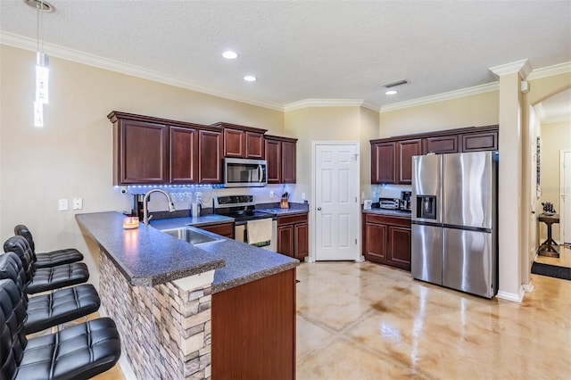 1031 Andrew Aviles Cir, Tampa, FL 33619 - kitchen with stainless steel appliances, a peninsula, dark countertops, a breakfast bar, and a textured ceiling