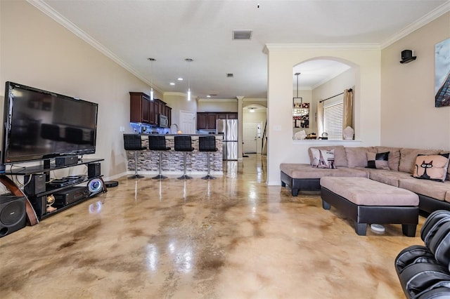 1031 Andrew Aviles Cir, Tampa, FL 33619 - living room with finished concrete flooring, arched walkways, and ornamental molding