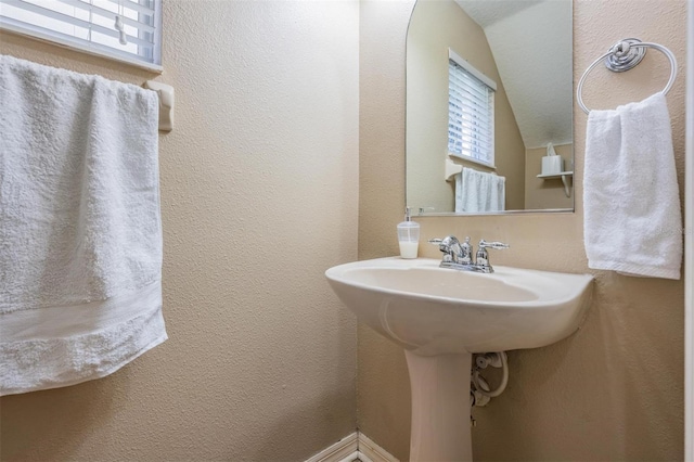 1031 Andrew Aviles Cir, Tampa, FL 33619 - bathroom featuring healthy amount of natural light and a textured wall