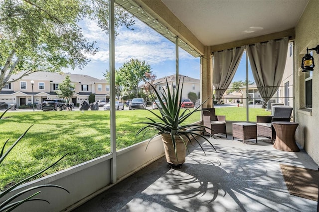 1031 Andrew Aviles Cir, Tampa, FL 33619 - sunroom / solarium featuring a residential view
