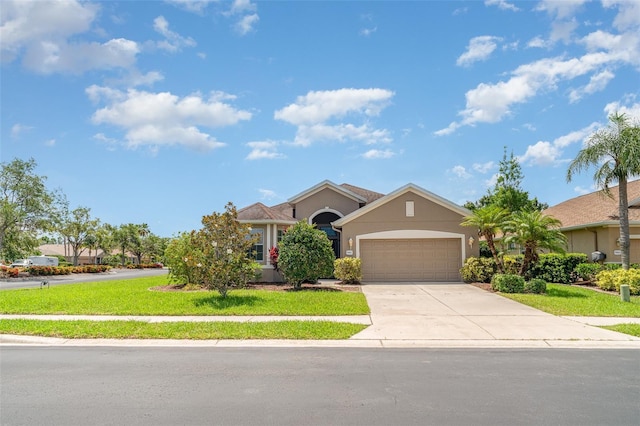 9067 39th Street Cir E, Parrish, FL 34219 - obstructed view of property with stucco siding, an attached garage, driveway, and a front yard