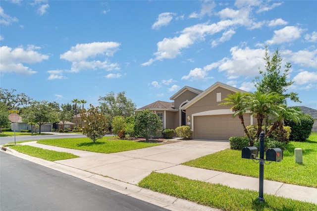 9067 39th Street Cir E, Parrish, FL 34219 - view of front of home featuring stucco siding, a garage, driveway, and a front yard