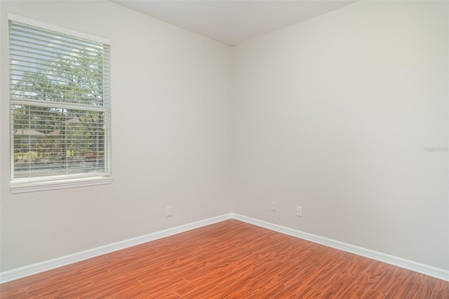 9067 39th Street Cir E, Parrish, FL 34219 - unfurnished room featuring wood finished floors and baseboards