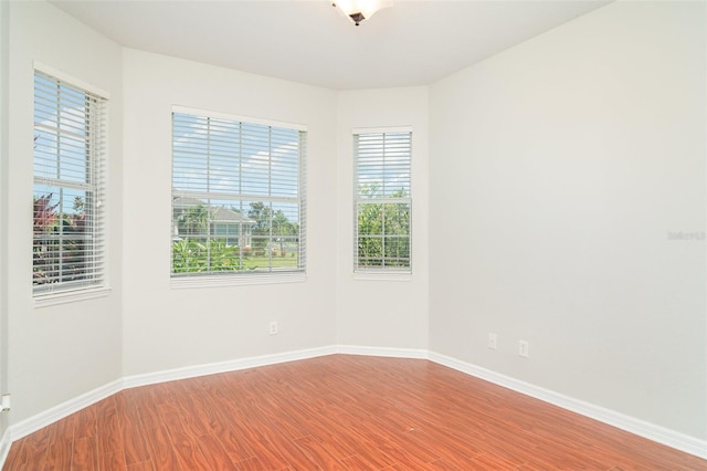 9067 39th Street Cir E, Parrish, FL 34219 - unfurnished room with wood finished floors and baseboards