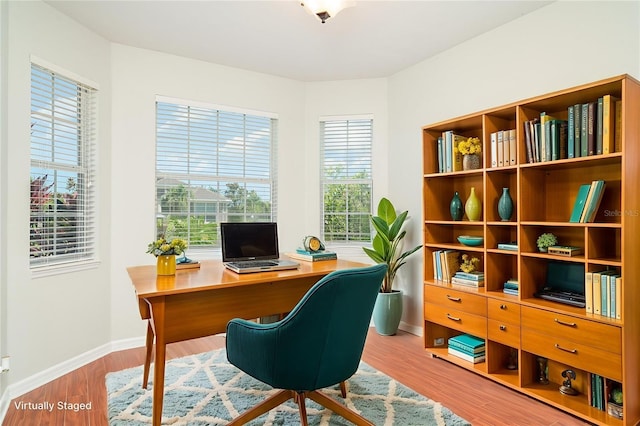 9067 39th Street Cir E, Parrish, FL 34219 - office area featuring baseboards and wood finished floors