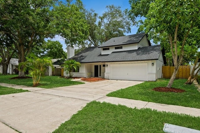 14909 Oldgate Pl, Tampa, FL 33624 - view of front of property featuring a chimney, concrete driveway, a garage, and a shingled roof