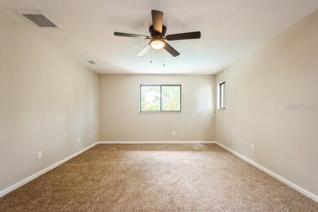 14909 Oldgate Pl, Tampa, FL 33624 - spare room with carpet flooring and ceiling fan