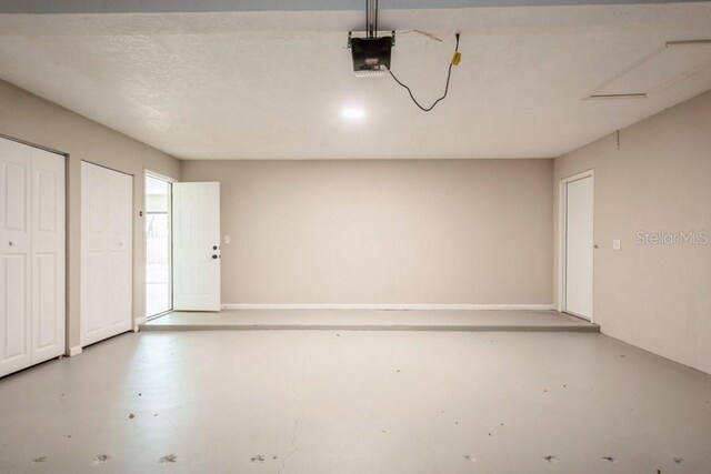 14909 Oldgate Pl, Tampa, FL 33624 - garage featuring a garage door opener