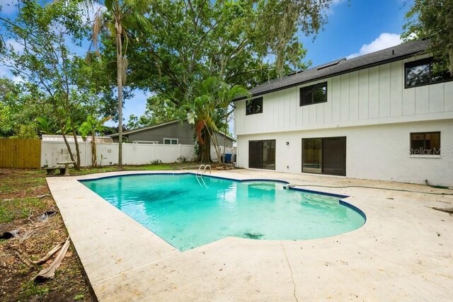 14909 Oldgate Pl, Tampa, FL 33624 - view of swimming pool with a patio area