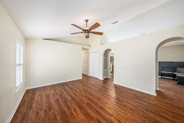 3443 Fyfield Ct, Land O Lakes, FL 34638 - unfurnished room featuring arched walkways, ceiling fan, wood finished floors, and lofted ceiling