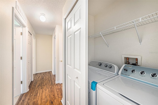 3443 Fyfield Ct, Land O Lakes, FL 34638 - washroom with washer and clothes dryer and dark wood-style flooring