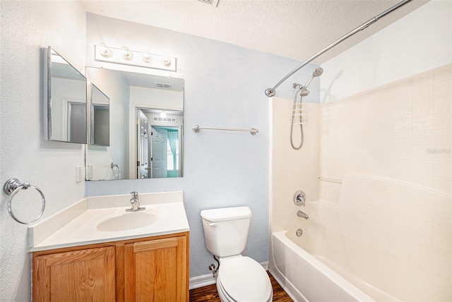 3443 Fyfield Ct, Land O Lakes, FL 34638 - bathroom with vanity, bathtub / shower combination, a textured ceiling, and wood finished floors
