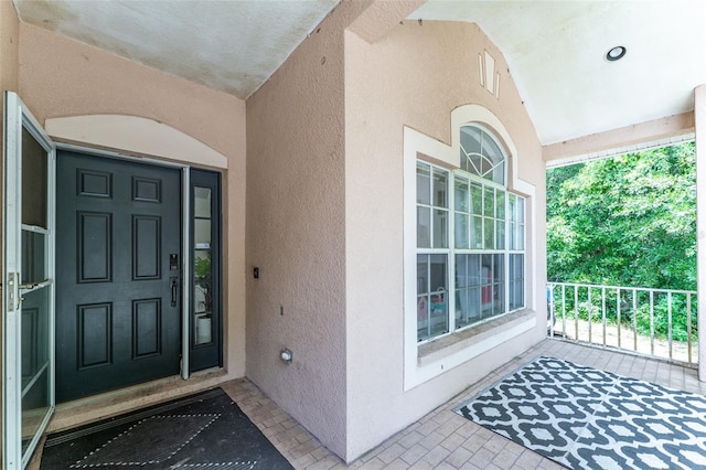 8050 Diablo Ct, Trinity, FL 34655 - property entrance with stucco siding