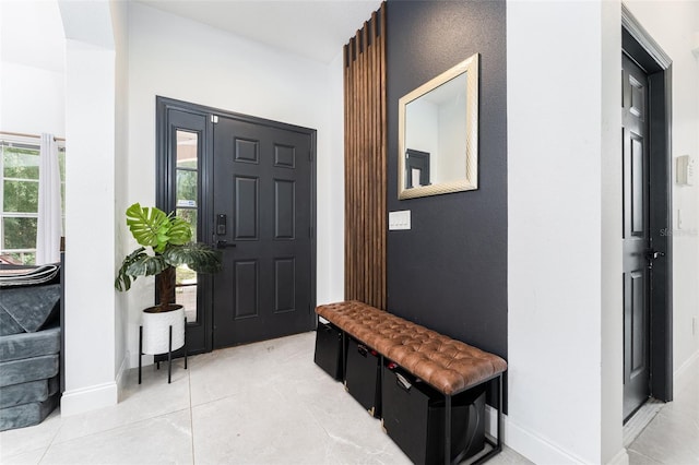 8050 Diablo Ct, Trinity, FL 34655 - foyer with baseboards and light tile patterned floors