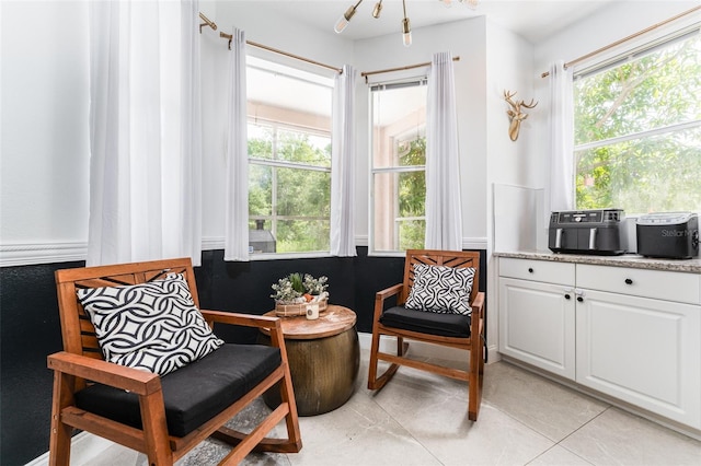 8050 Diablo Ct, Trinity, FL 34655 - sitting room with plenty of natural light and light tile patterned floors